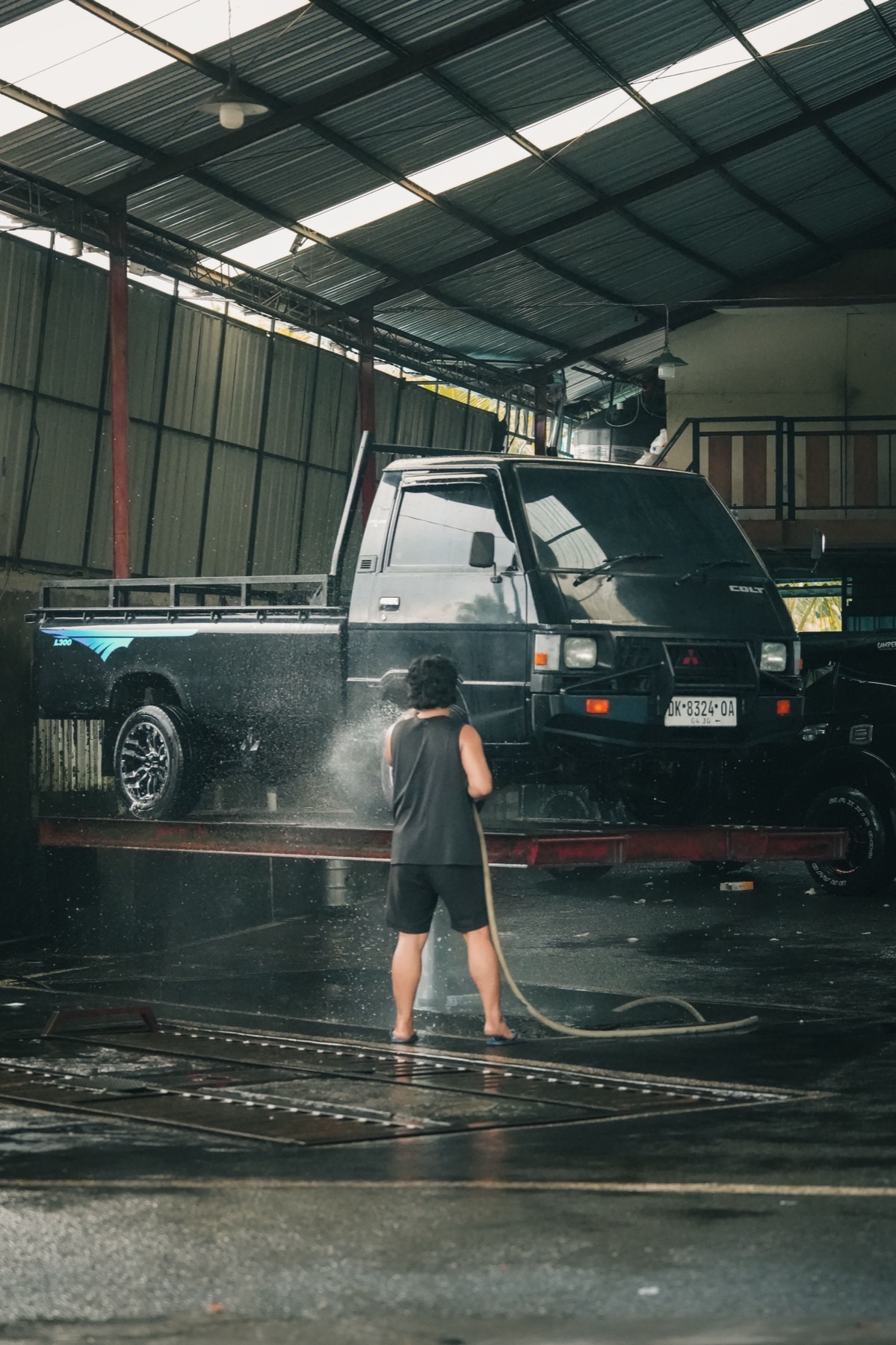 Washing down a pickup at the OTEK service bay